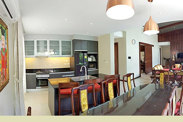 Dining, Living and Kitchen Area with Garden and Pool View